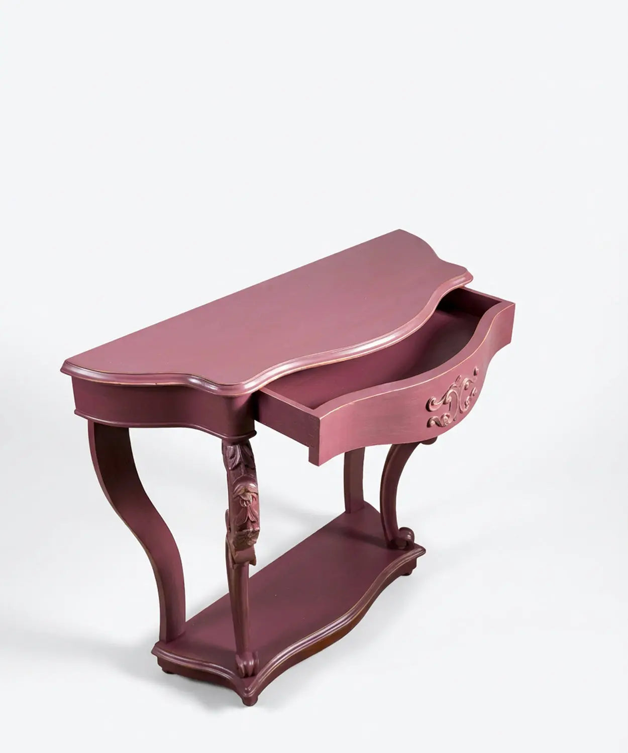 Vista superior de consola rosa con el cajón central abierto mostrando capacidad de almacenaje