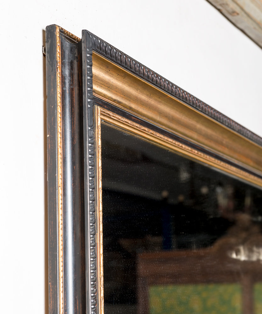 Antique mirror with black and gold frame