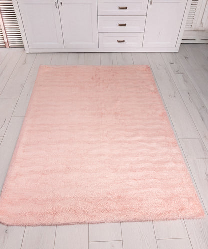 Alfombra rosa de pelo largo