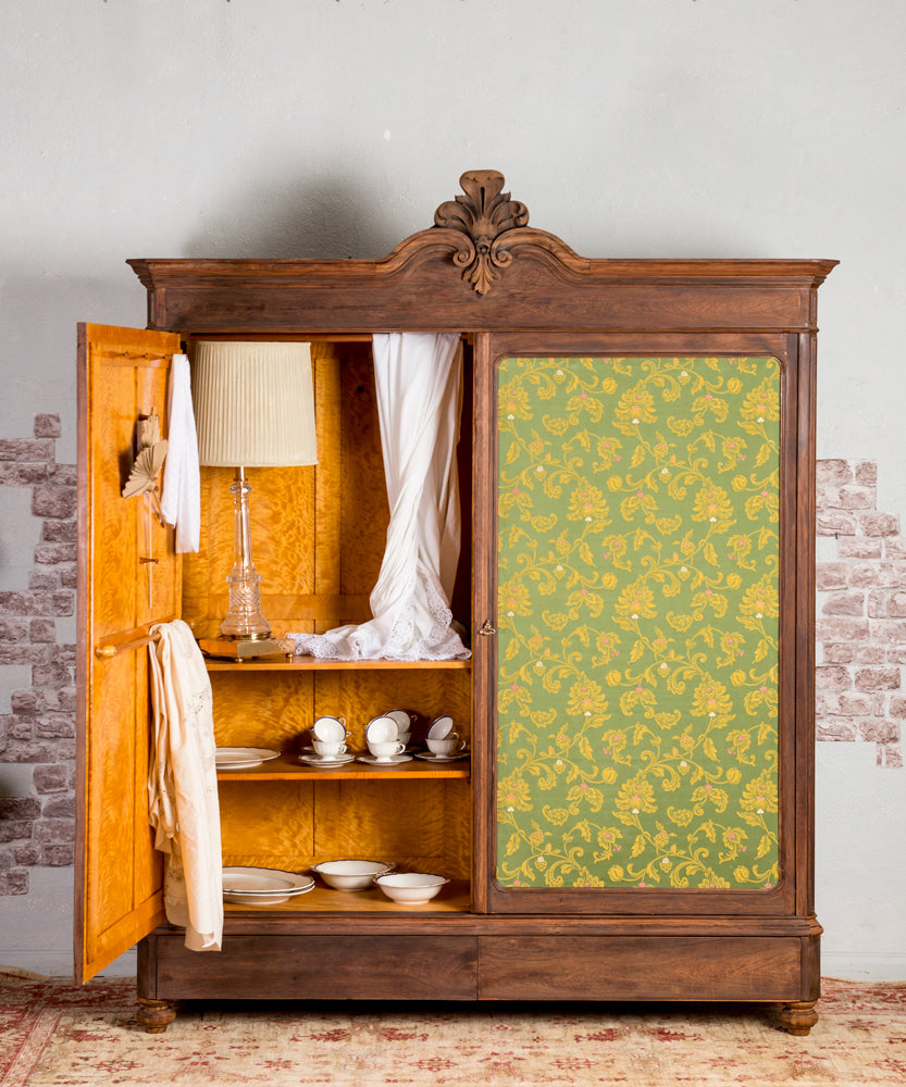 Antique wardrobe with upholstered doors