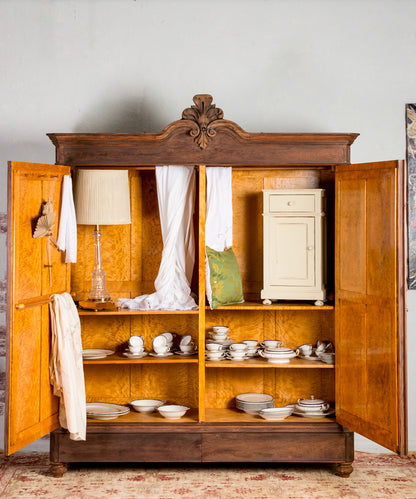 Antique wardrobe with upholstered doors