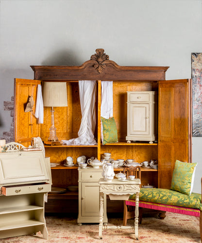 Antique wardrobe with upholstered doors