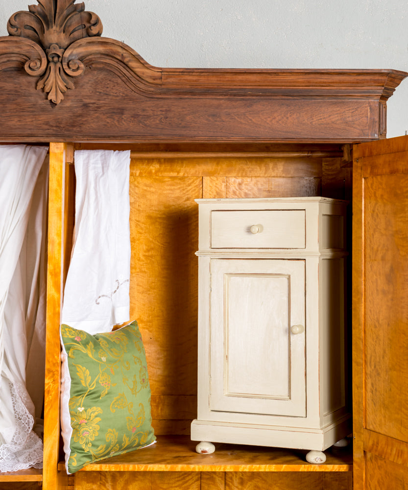 Antique wardrobe with upholstered doors