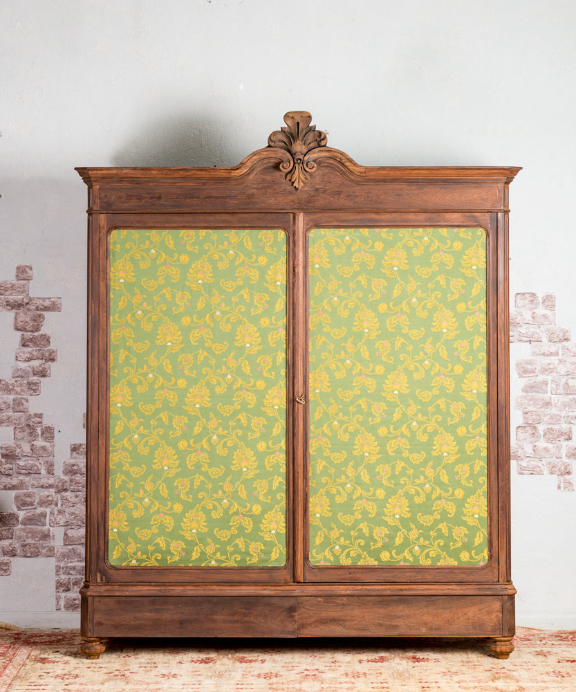 Antique wardrobe with upholstered doors