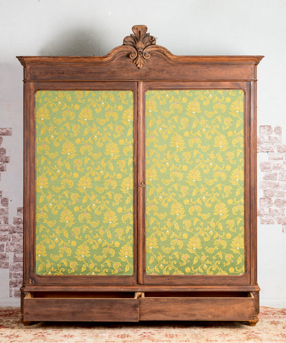 Antique wardrobe with upholstered doors