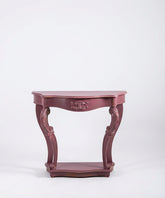 Frente de mesa consola clásica color malva con detalles ornamentales tallados en el faldón