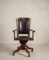 Sillón de despacho giratorio vintage en piel negra vista frontal — Antique Arte y Decoración